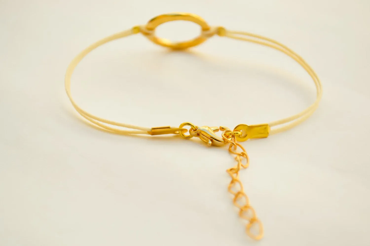 Karma bracelet for women, gold circle and beige cord, yoga jewelry